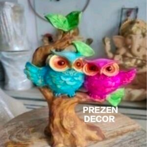 POLY RESIN OWLS ON BRANCH STATUE